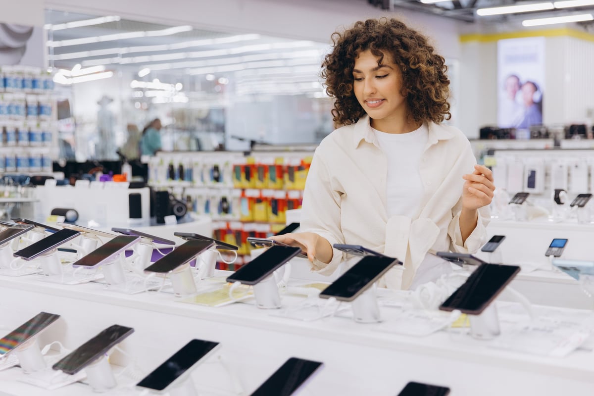 Customer shopping for smartphones in store