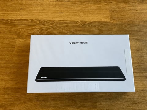 Galaxy Tab A11 tablet box on wooden surface showing front view of device